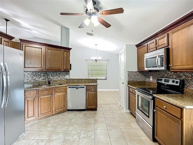 10901 Peppersong Dr, Riverview, FL 33578 - kitchen with stainless steel appliances, vaulted ceiling, tasteful backsplash, a ceiling fan, and light tile patterned floors