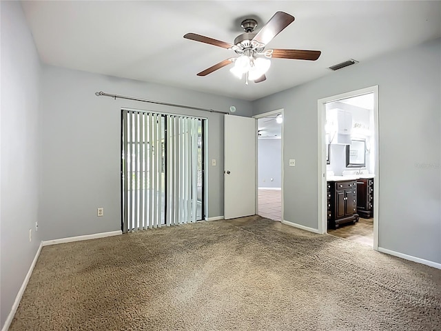 10901 Peppersong Dr, Riverview, FL 33578 - unfurnished bedroom featuring carpet floors, connected bathroom, and a ceiling fan