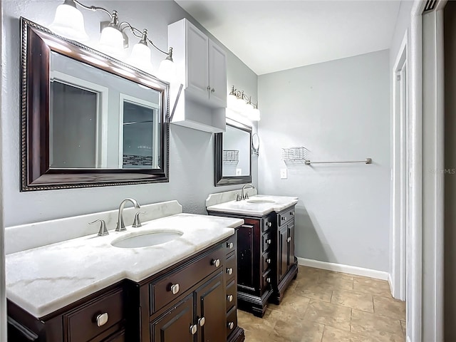 10901 Peppersong Dr, Riverview, FL 33578 - bathroom with two vanities and baseboards