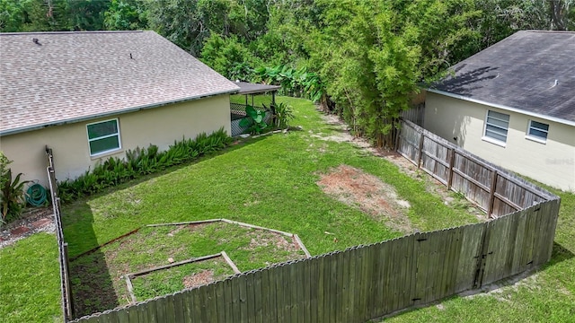 10901 Peppersong Dr, Riverview, FL 33578 - fenced backyard featuring a vegetable garden