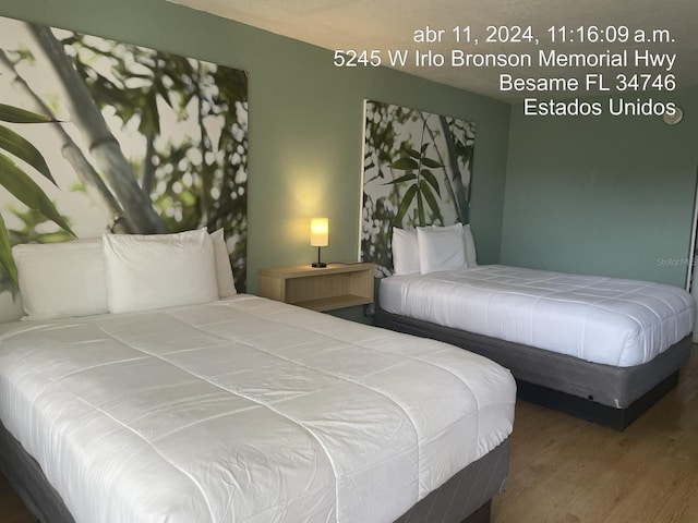 5245 W Irlo Bronson Memorial Hwy Unit 185, Kissimmee, FL 34746 - bedroom with wood finished floors