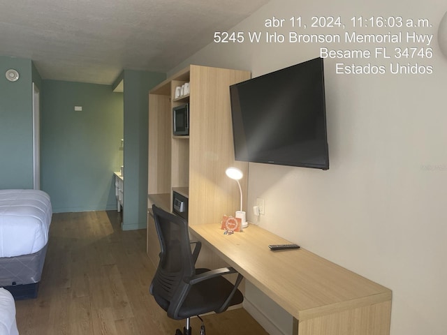 5245 W Irlo Bronson Memorial Hwy Unit 185, Kissimmee, FL 34746 - office area with wood finished floors and baseboards