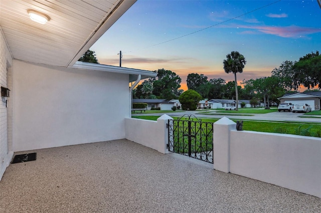 749 Ridge Blvd, South Daytona, FL 32119 - patio terrace at dusk featuring a lawn