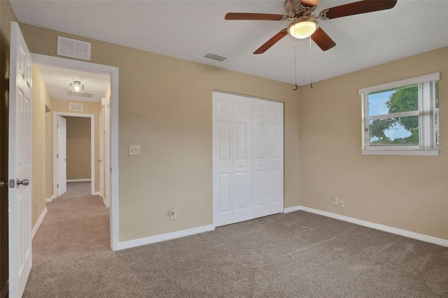 749 Ridge Blvd, South Daytona, FL 32119 - unfurnished bedroom with carpet flooring, a closet, and ceiling fan