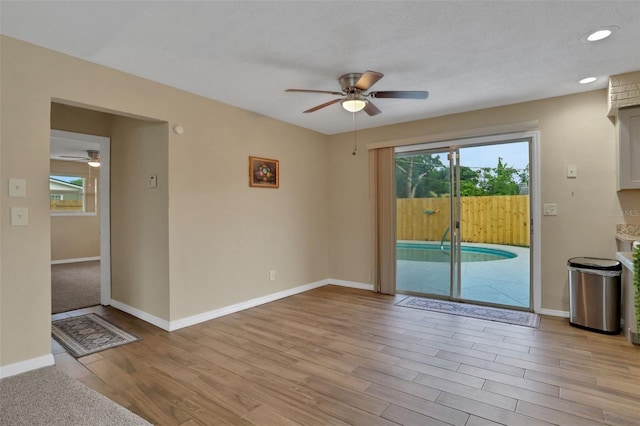 749 Ridge Blvd, South Daytona, FL 32119 - unfurnished living room featuring a ceiling fan, wood finished floors, and recessed lighting