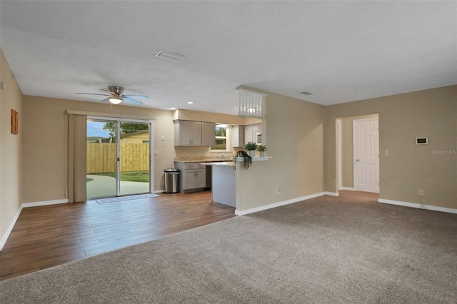 749 Ridge Blvd, South Daytona, FL 32119 - unfurnished living room with carpet and a ceiling fan