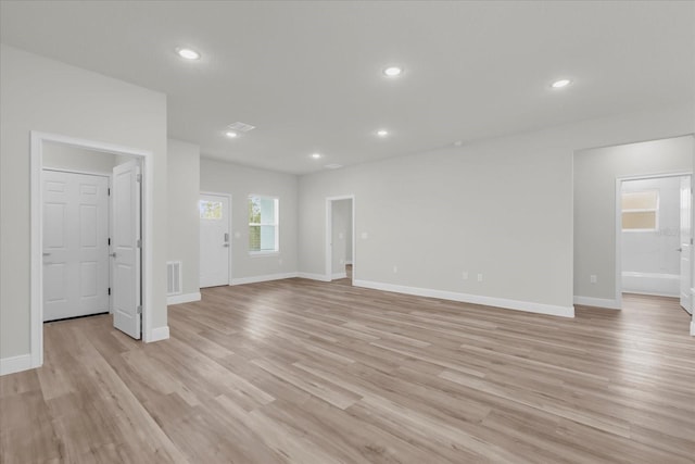 13673 SW 43th Cir, Ocala, FL 34473 - unfurnished living room with light wood-type flooring and recessed lighting