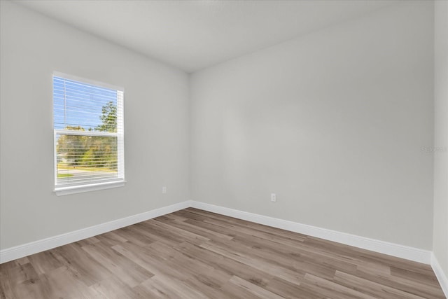 13673 SW 43th Cir, Ocala, FL 34473 - unfurnished room with light wood finished floors and baseboards