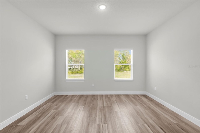 13673 SW 43th Cir, Ocala, FL 34473 - empty room featuring light wood-type flooring and baseboards