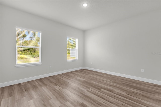 13673 SW 43th Cir, Ocala, FL 34473 - spare room featuring light wood-style flooring and recessed lighting