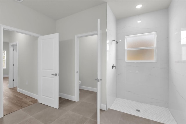 13673 SW 43th Cir, Ocala, FL 34473 - bathroom featuring a tile shower, tile patterned floors, and recessed lighting