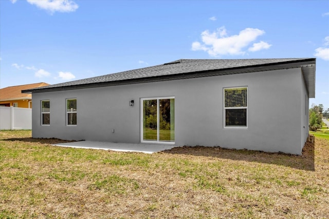 13673 SW 43th Cir, Ocala, FL 34473 - rear view of property with a patio, stucco siding, and roof with shingles
