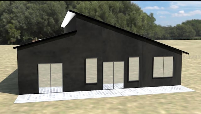 SW 162nd Lane, Ocala, FL 34473 - view of home's exterior with a wooded view
