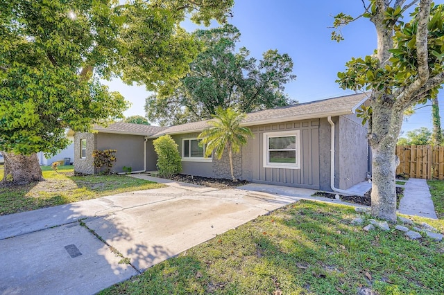 1175 Tracy Dr, Port Orange, FL 32129 - single story home featuring board and batten siding and stucco siding