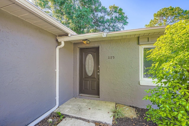 1175 Tracy Dr, Port Orange, FL 32129 - view of exterior entry with stucco siding