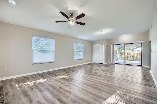 1175 Tracy Dr, Port Orange, FL 32129 - unfurnished room featuring a ceiling fan and wood finished floors
