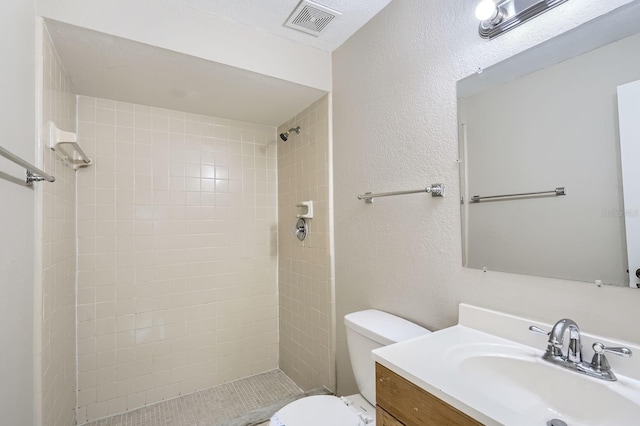 1175 Tracy Dr, Port Orange, FL 32129 - full bath featuring vanity, tiled shower, and a textured wall