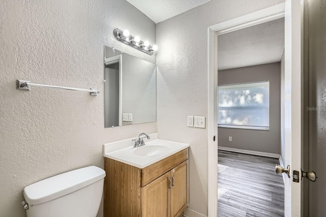 1175 Tracy Dr, Port Orange, FL 32129 - bathroom with vanity, wood finished floors, and a textured wall
