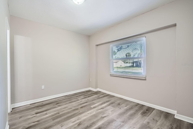 1175 Tracy Dr, Port Orange, FL 32129 - spare room with wood finished floors and baseboards