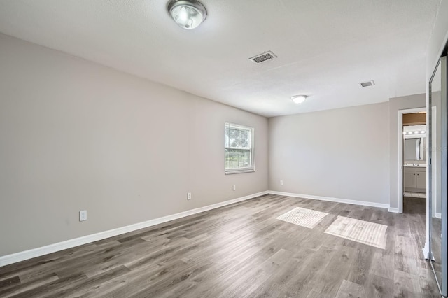 1175 Tracy Dr, Port Orange, FL 32129 - spare room featuring wood finished floors