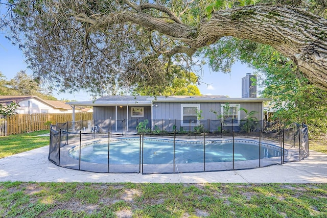 1175 Tracy Dr, Port Orange, FL 32129 - back of property featuring a chimney, board and batten siding, and a patio area