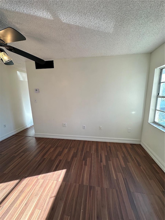 1918 Honour Rd Unit 4, Orlando, FL 32839 - unfurnished room featuring a textured ceiling, dark wood-style flooring, and a ceiling fan