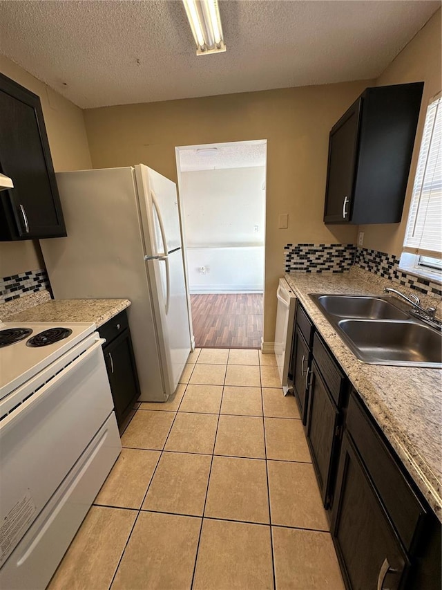 1918 Honour Rd Unit 4, Orlando, FL 32839 - kitchen featuring electric stove, decorative backsplash, dishwashing machine, light tile patterned flooring, and a textured ceiling