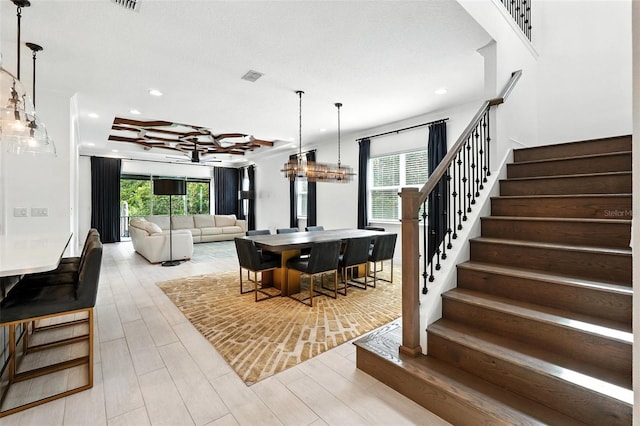 15315 Gilligan Ct, Winter Garden, FL 34787 - dining room featuring stairs, light wood-style floors, and recessed lighting
