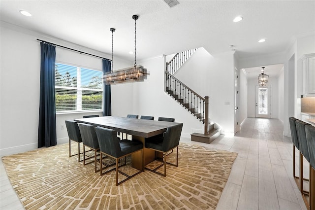 15315 Gilligan Ct, Winter Garden, FL 34787 - dining area featuring stairway, ornamental molding, a chandelier, recessed lighting, and light wood finished floors