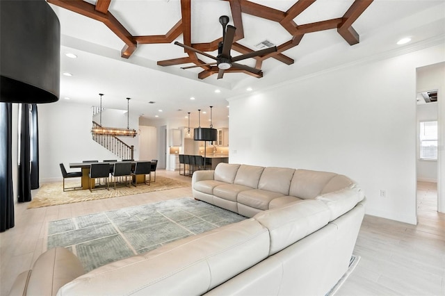 15315 Gilligan Ct, Winter Garden, FL 34787 - living area featuring ceiling fan, light wood-style floors, recessed lighting, ornamental molding, and a chandelier