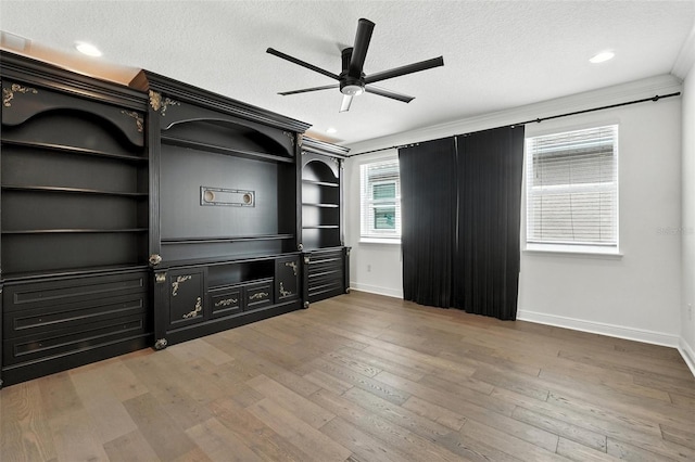 15315 Gilligan Ct, Winter Garden, FL 34787 - unfurnished living room with ceiling fan, a textured ceiling, wood finished floors, and recessed lighting