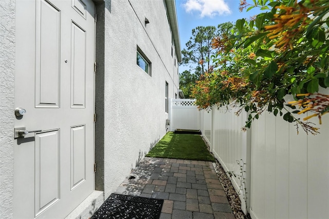 15315 Gilligan Ct, Winter Garden, FL 34787 - view of home's exterior with stucco siding and a fenced backyard