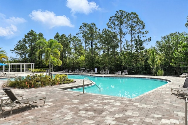 15315 Gilligan Ct, Winter Garden, FL 34787 - community pool featuring a patio area and view of scattered trees