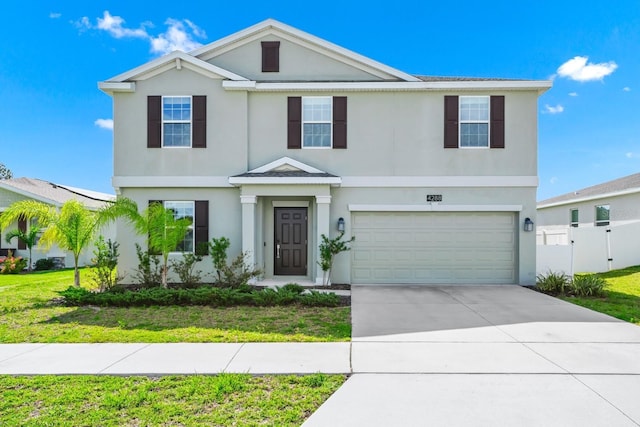 4288 Blackshear Ct, Clermont, FL 34714 - view of front of property featuring stucco siding, a garage, and driveway