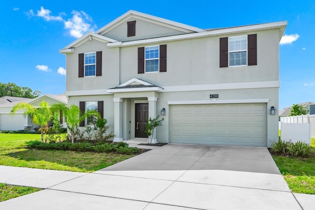 4288 Blackshear Ct, Clermont, FL 34714 - view of front of property featuring stucco siding, a garage, and driveway