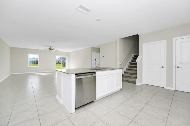 4288 Blackshear Ct, Clermont, FL 34714 - kitchen with dishwasher, ceiling fan, light tile patterned floors, white cabinets, and open floor plan