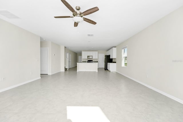 4288 Blackshear Ct, Clermont, FL 34714 - unfurnished living room featuring ceiling fan and light tile patterned floors