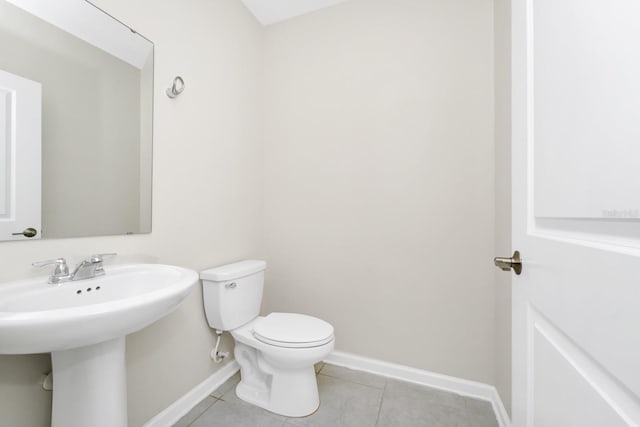 4288 Blackshear Ct, Clermont, FL 34714 - half bathroom with tile patterned flooring and toilet