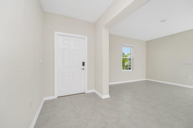 4288 Blackshear Ct, Clermont, FL 34714 - entryway with baseboards and light tile patterned floors