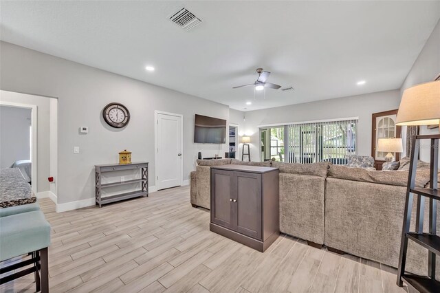 4636 Piedmont St, Orlando, FL 32811 - living room with a ceiling fan, light wood finished floors, and recessed lighting