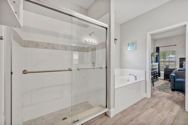 4636 Piedmont St, Orlando, FL 32811 - bathroom with a bath, a shower stall, and connected bathroom