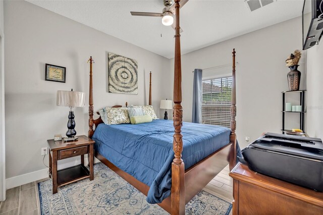 4636 Piedmont St, Orlando, FL 32811 - bedroom with baseboards and a ceiling fan