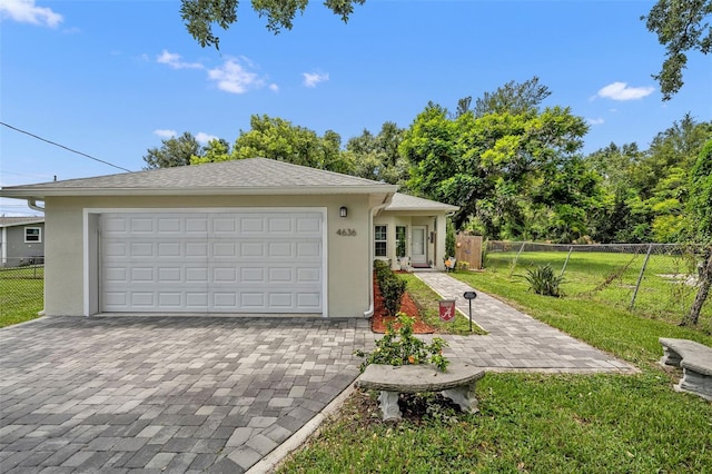 4636 Piedmont St, Orlando, FL 32811 - view of front facade featuring stucco siding and decorative driveway