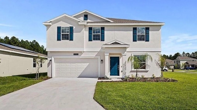 16480 Fernridge St, Clermont, FL 34714 - traditional-style home featuring a garage, a front yard, driveway, and stucco siding