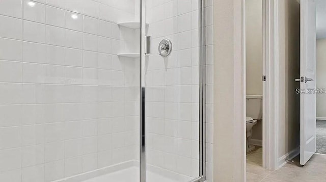 16480 Fernridge St, Clermont, FL 34714 - bathroom featuring a stall shower and toilet