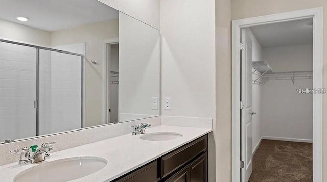 16480 Fernridge St, Clermont, FL 34714 - full bath featuring double vanity, a shower stall, and a spacious closet