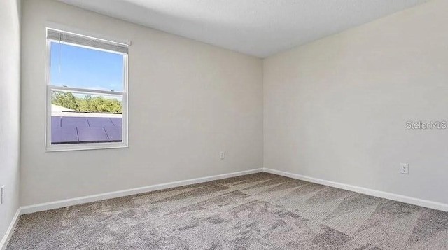 16480 Fernridge St, Clermont, FL 34714 - carpeted empty room with baseboards