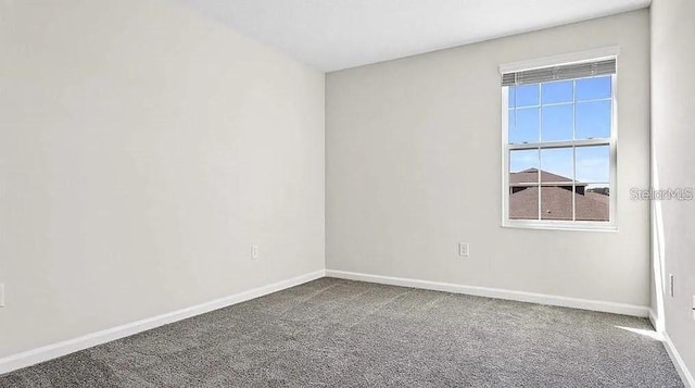 16480 Fernridge St, Clermont, FL 34714 - carpeted empty room with baseboards