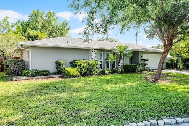 7201 Pleasant Dr, Orlando, FL 32818 - ranch-style house featuring stucco siding, a garage, and driveway