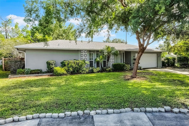 7201 Pleasant Dr, Orlando, FL 32818 - ranch-style house with stucco siding, an attached garage, and driveway